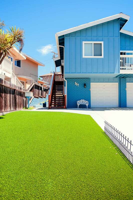 artificial grass lawn with blue california home